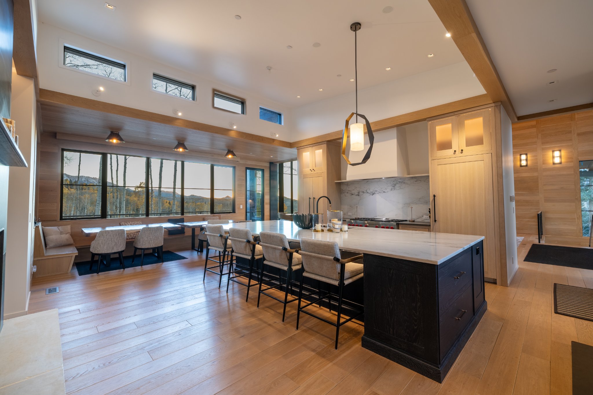 Open concept — great room, kitchen, and dining with mountain views